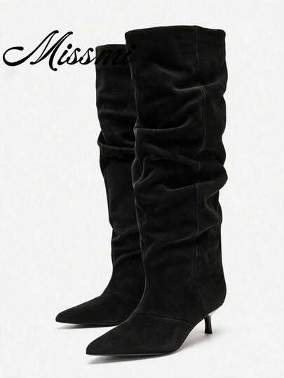 Botas altas negras plisadas